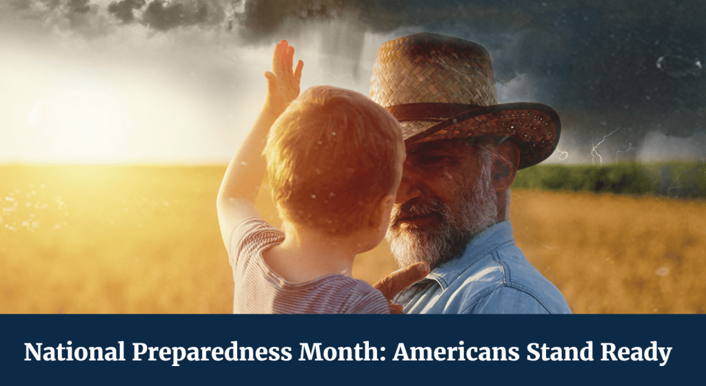 Image for National Preparedness Month showing an older man holding a young child in a field as dark storm clouds and lightning approach in the background. Text reads, “National Preparedness Month: Americans Stand Ready.”